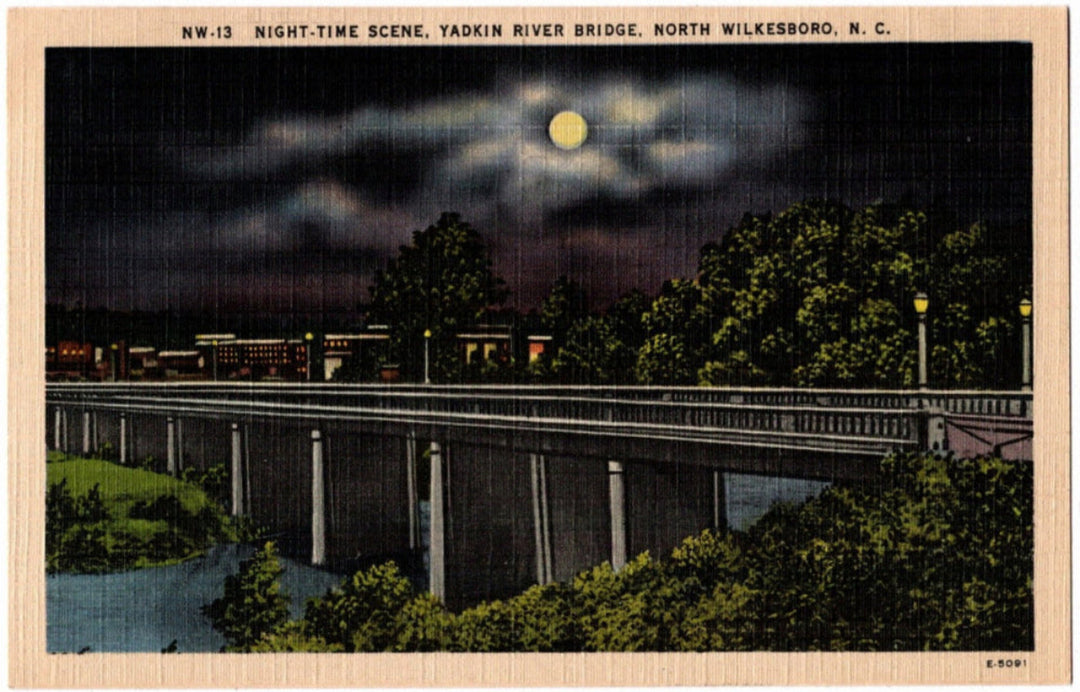Night-time scene of a bridge over a river with moonlit sky, Yaxkin River Bridge, North Wilkesboro, N.C.