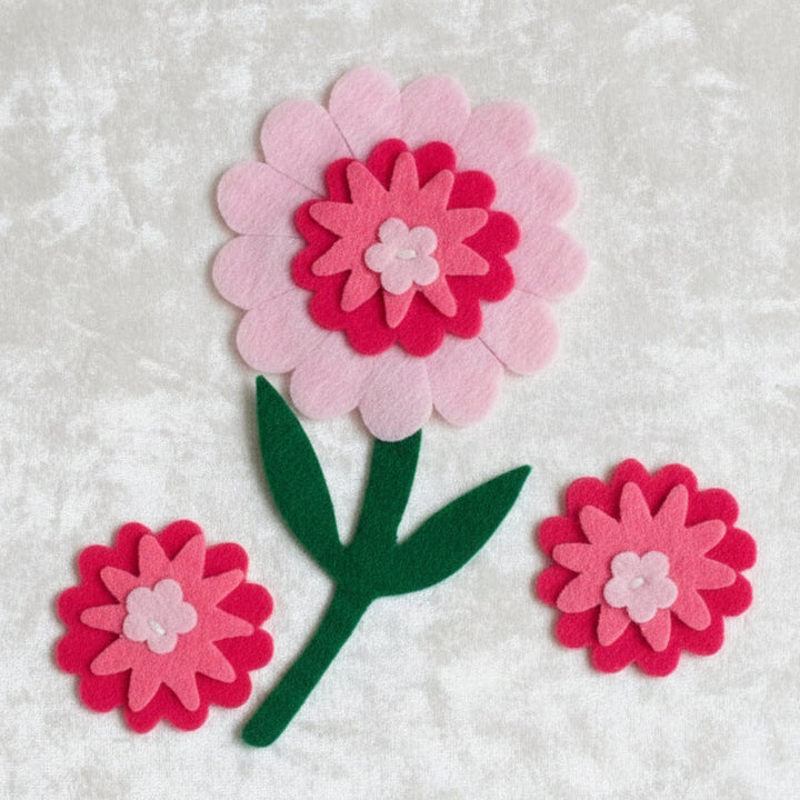 1950-60s Vintage Pink Felt Flower Appliques NOS Postwar Sewing Supplies, displayed on velvet.