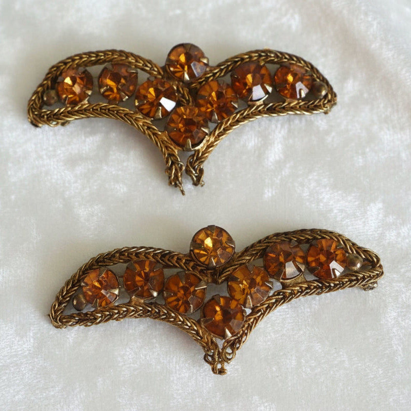 A pair of vintage bronze bullion appliques with topaz rhinestone embellishments.