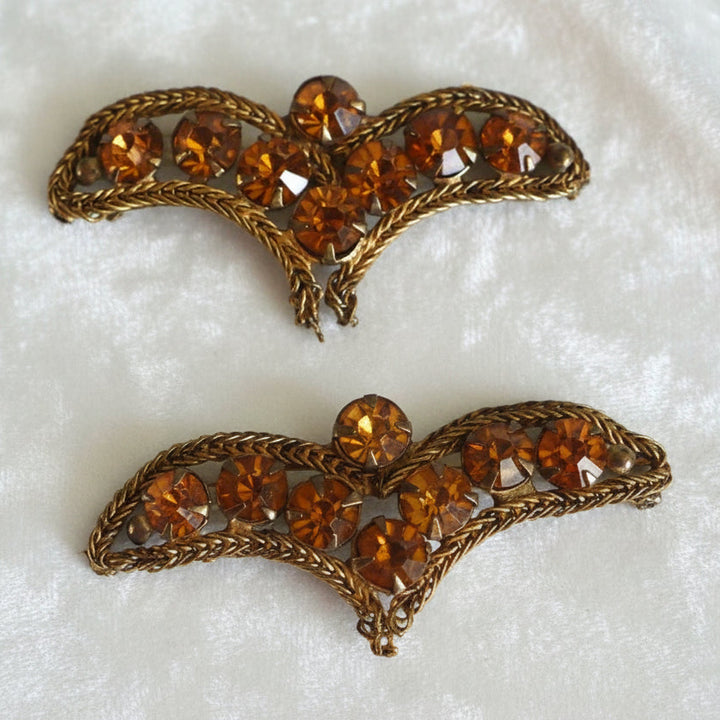 A pair of vintage bronze bullion appliques with topaz rhinestone embellishments.