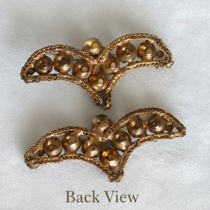 A pair of vintage bronze bullion appliques with topaz rhinestone embellishments.