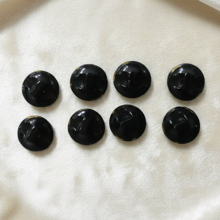 Set of eight 1920s vintage black and gold Art Deco round molded glass diminutive buttons. Round balls with tunnel shanks.