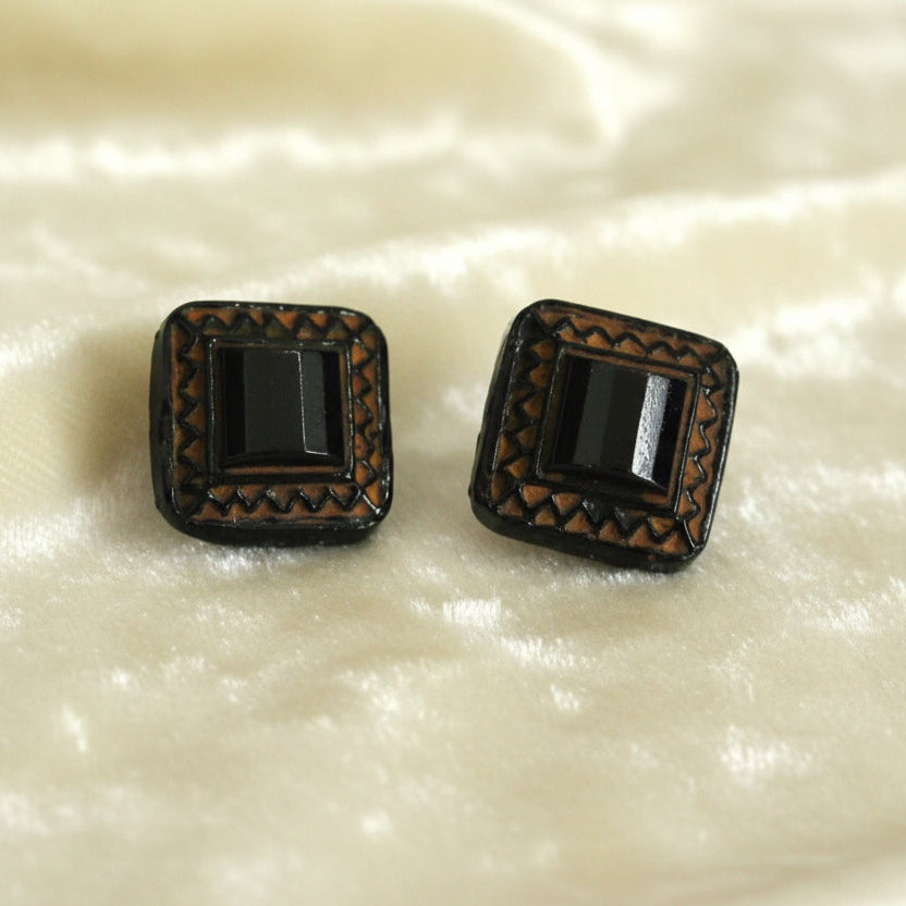 Produced in the Jablonec area of the Czech Republic starting in the 1800s and continuing into the 20th century. Set of two black glass mourning, self-shank buttons with contrasting painted details.
Measure approximately 13 lignes, 8.2 mm., or 5/16".