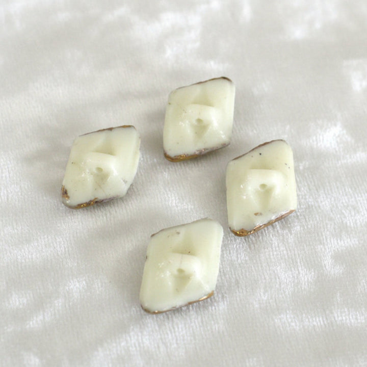 25L Set of Four 1920s–30s Czech Uranium Milk Glass Buttons, 5/8".