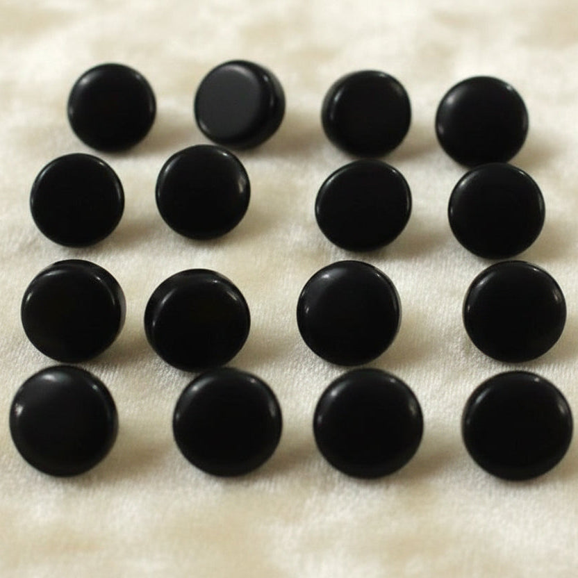 Set of sixteen black glass diminutive buttons. Circa 1800s Victorian mourning, vintage sewing supply.