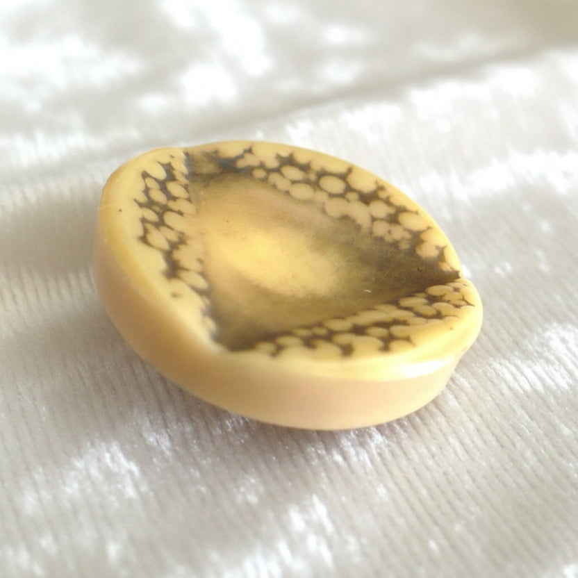 Vintage late 1940s to 1950s Brutalist celluloid coat buttons – set of four.