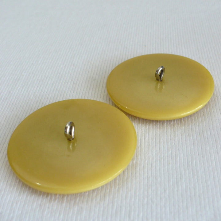 69L Set of Two Mid Century Mustard Yellow Coat Buttons 1 3/4".