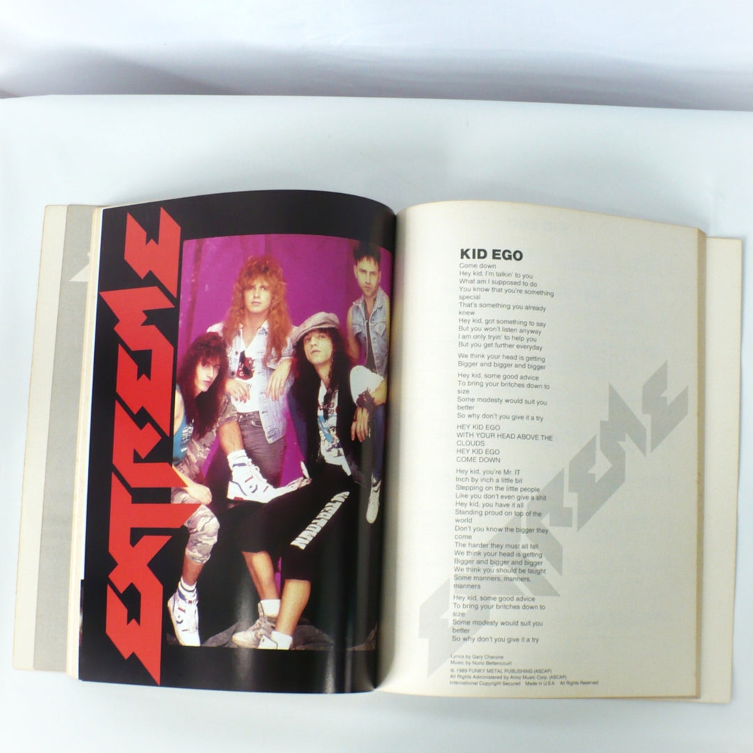 Full-page color band photo and lyric sheet for 'Kid Ego' from the original 1989 Extreme guitar tab book.