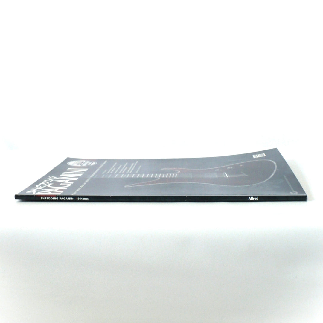 Spine of the Shredding Paganini guitar book by German Schauss, showing clear title branding and Alfred Music publishing logo.