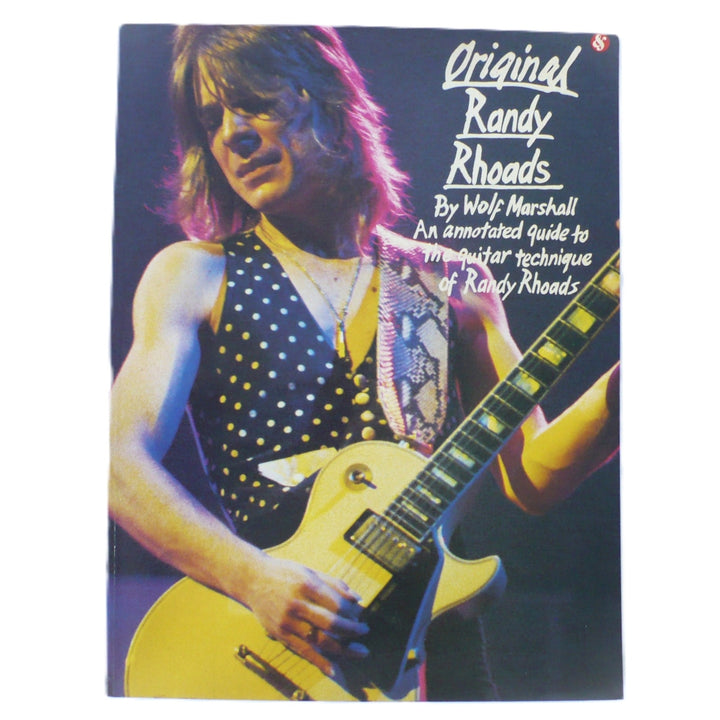 Front cover of 1986 Original Randy Rhoads guitar tab book by Wolf Marshall featuring Randy with his white Gibson Les Paul Custom.