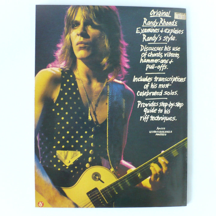 Back cover of 1986 Original Randy Rhoads guitar book by Amsco Publications featuring a summary of Randy's technique and the original $9.95 price sticker.