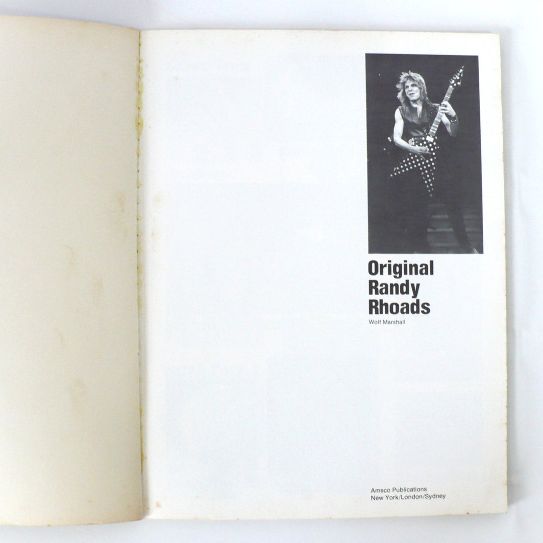 Interior title page of the 1986 first edition Original Randy Rhoads guitar tab book, featuring Randy Rhoads photography and Amsco Publications branding.