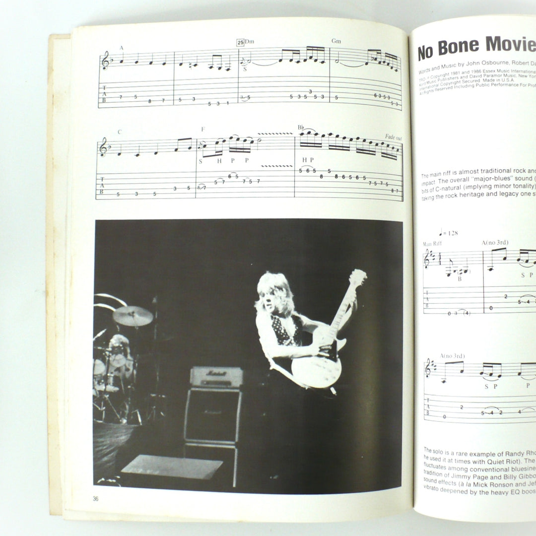 Interior page spread of the 1986 Original Randy Rhoads guitar tab book by Wolf Marshall, featuring the notation for "No Bone Movies" and a black-and-white performance photograph of Randy Rhoads.
