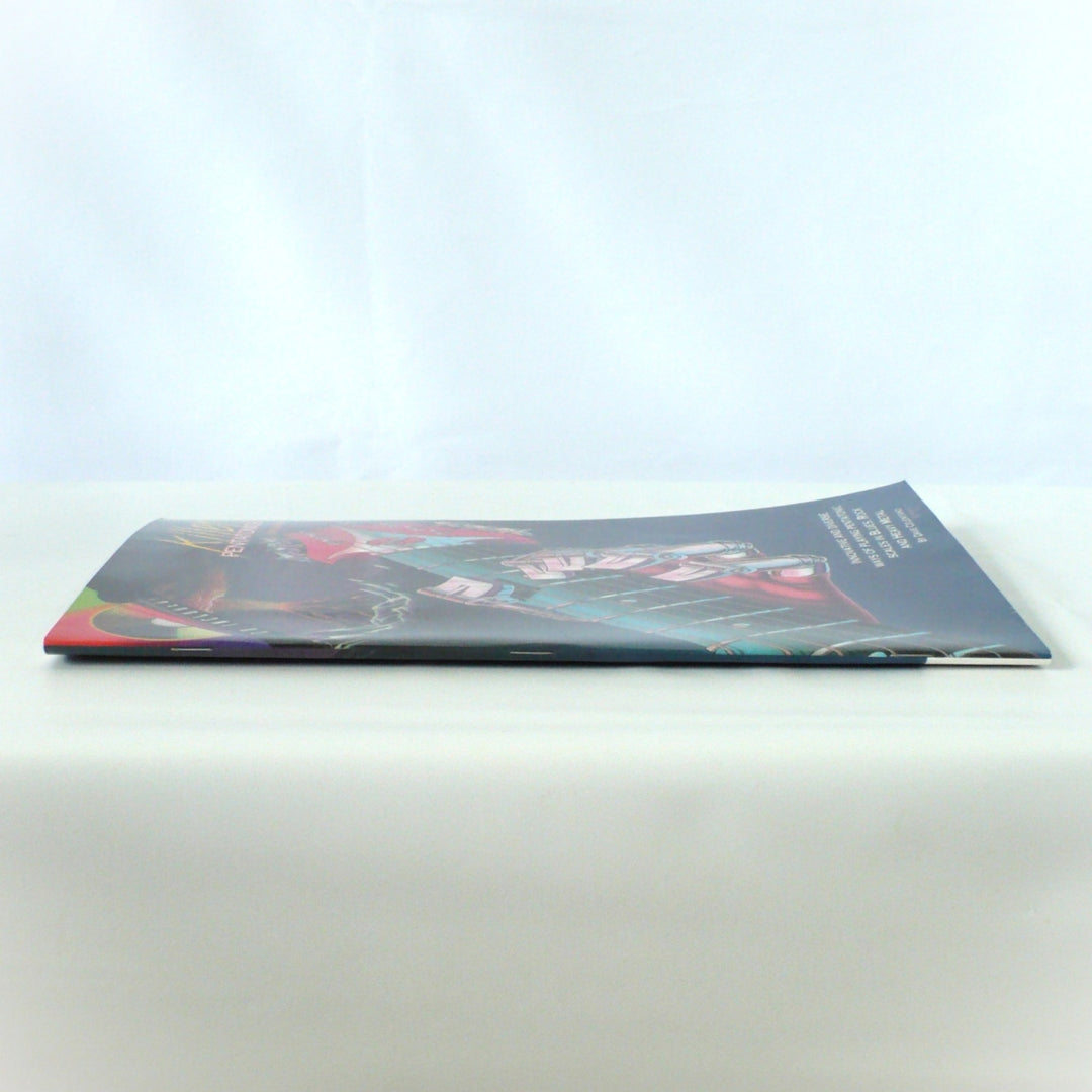 Side profile view showing the spine of 'Killer Pentatonics for Guitar' by Dave Celentano, demonstrating the saddle-stitch binding condition.
