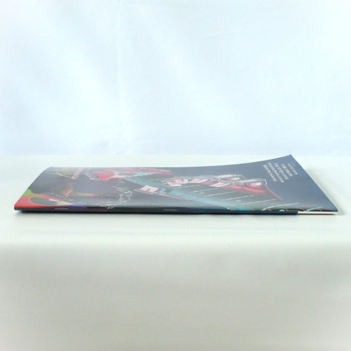 Side profile view showing the spine of 'Killer Pentatonics for Guitar' by Dave Celentano, demonstrating the saddle-stitch binding condition.