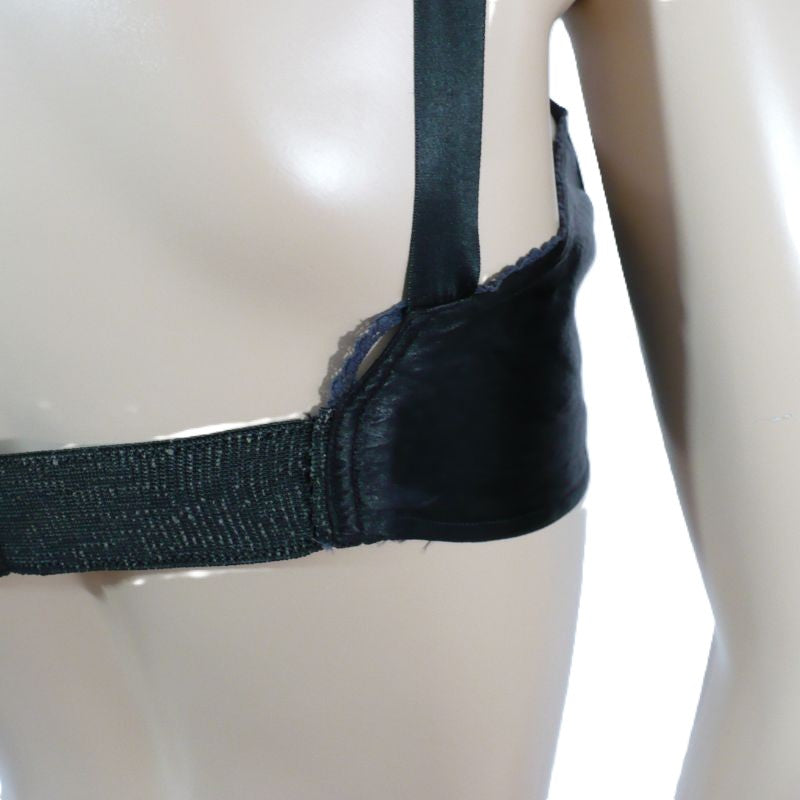 Black bra on a mannequin with a white background.