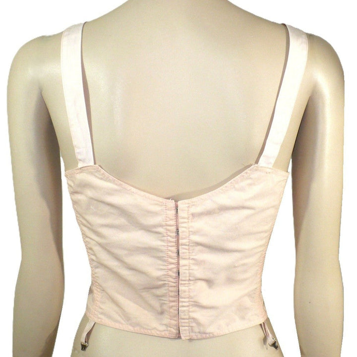 Peach 1940s Full Busted Babe Longline Bra with Girdle Hooks on a mannequin against a white background. Back View.