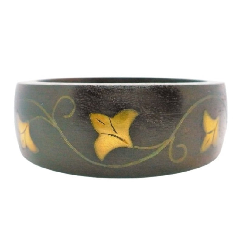 1970s Teak & Brass Floral Inlay Bangle Bracelet with white background.