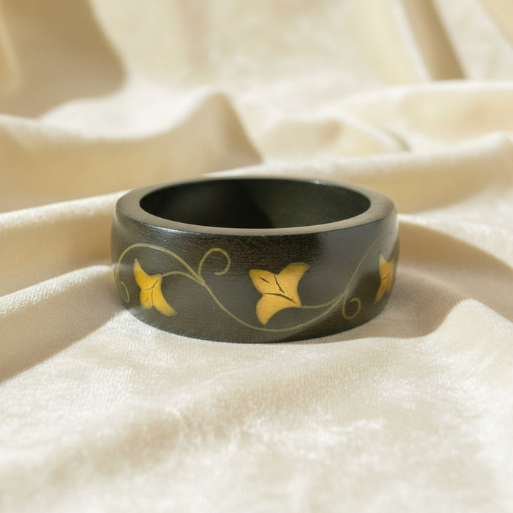 970 Vintage Brass Vine Inlay Teak Bangle Bracelet with white background.