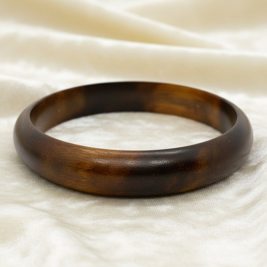 1970s Vintage Boho Teak Wood Hololith Bangle Bracelet with white background.