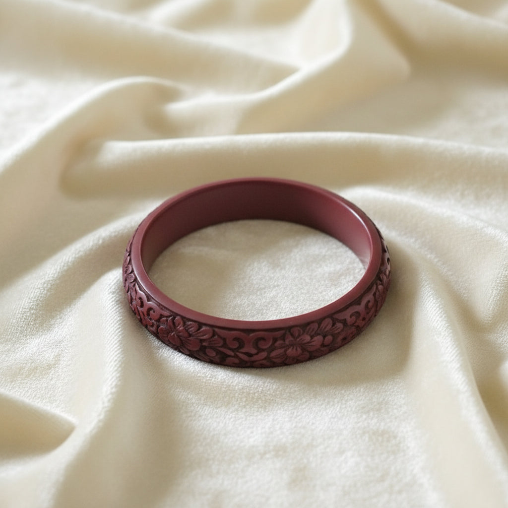 Vintage Auspicious Carved Red Cinnabar Bangle Bracelet on velvet.