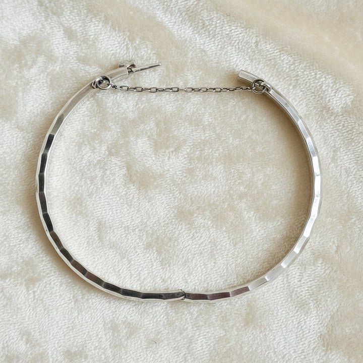 1970 Vintage Sterling Silver Faceted Charnière Hinged Bangle Bracelet, opened, on velvet background.