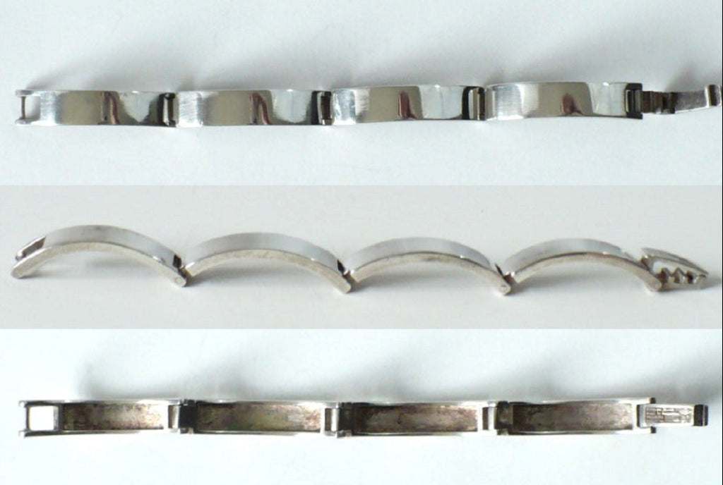 Three views of the bracelet montage, opened from above, side, and underside.