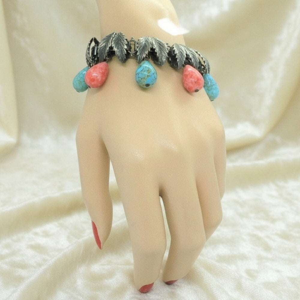 1930s Charm Bracelet with Hubbell Glass Beads, Native American-Inspired, on wrist..