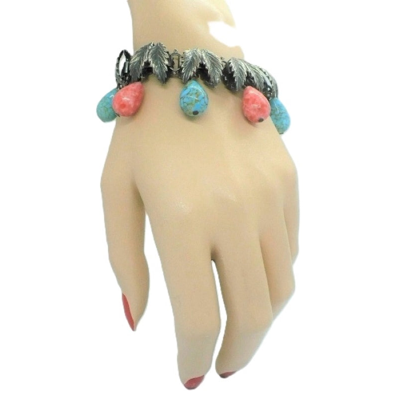 1930s Charm Bracelet with Hubbell Glass Beads, Native American-Inspired, on wrist..