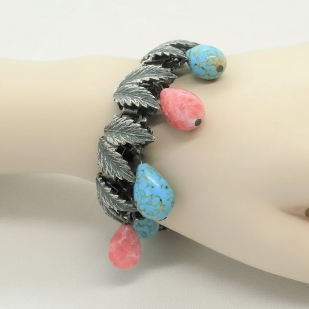 1930s Charm Bracelet with Hubbell Glass Beads, Native American-Inspired, on wrist..