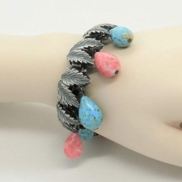 1930s Charm Bracelet with Hubbell Glass Beads, Native American-Inspired, on wrist..