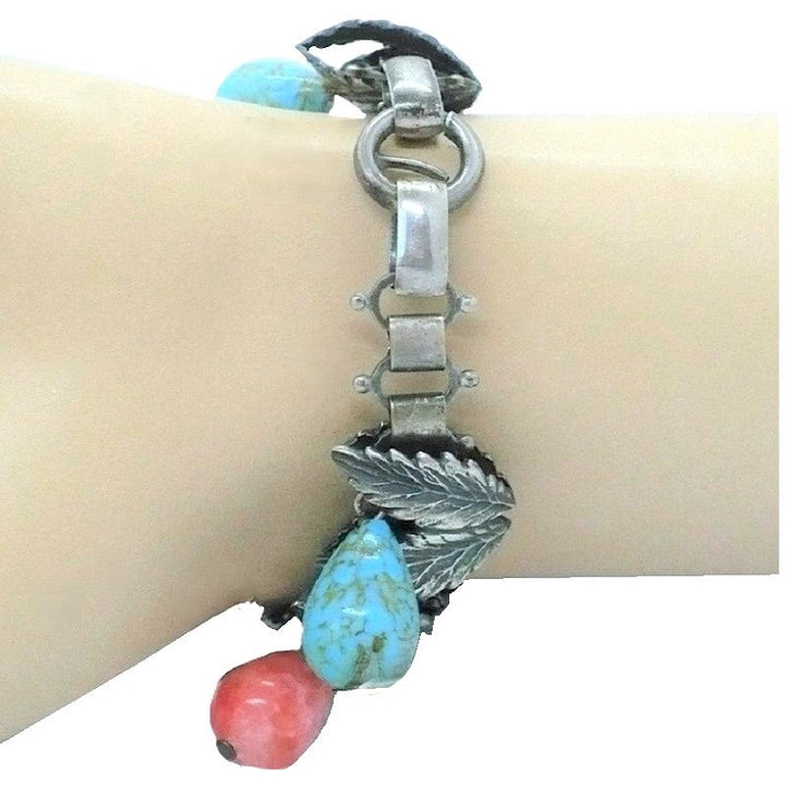 1930s Charm Bracelet with Hubbell Glass Beads, Native American-Inspired, on wrist, shows clasp,  and book chain
