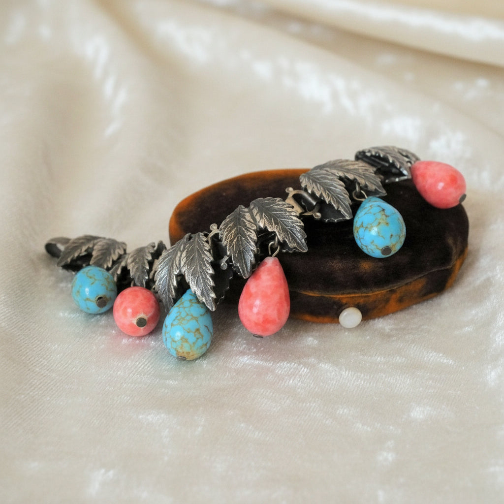 1930s Charm Bracelet with Hubbell Glass Beads, Native American-Inspired, displayed on box.