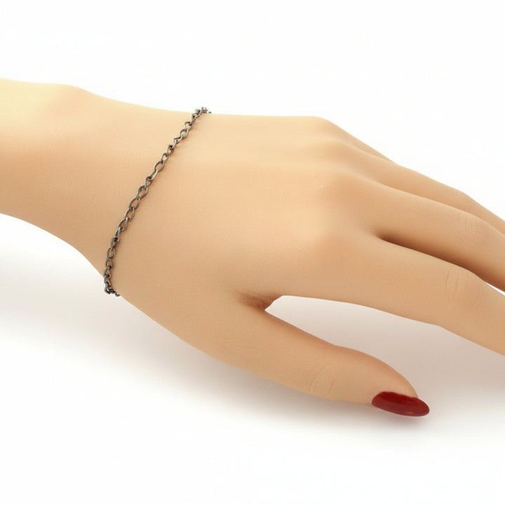 1940s Vintage Slender Siam Silver Chain Bracelet on mannequin hand with white background.