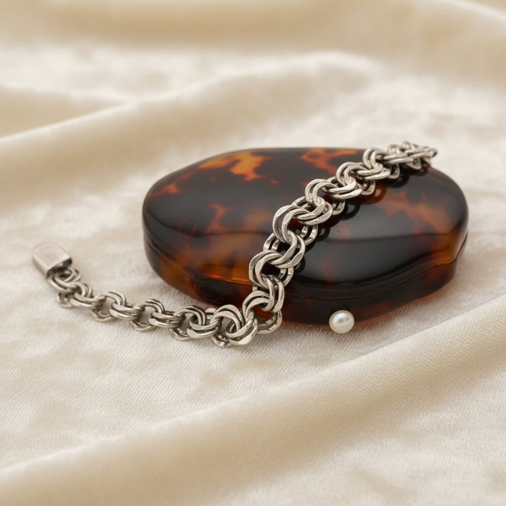 1950s Vintage Sterling Silver Double Link Bracelet for Charms by Lang displayed on tortoise shell case (not included).