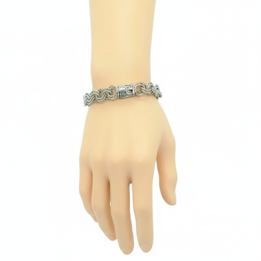 1950s Vintage Sterling Silver Double Link Bracelet for Charms by Lang on a mannequin hand against a white background