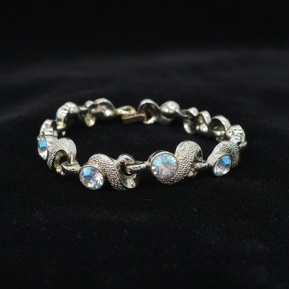 1950s Mid Century Vintage Aurora Borealis Crystal Bracelet on black velvet background.