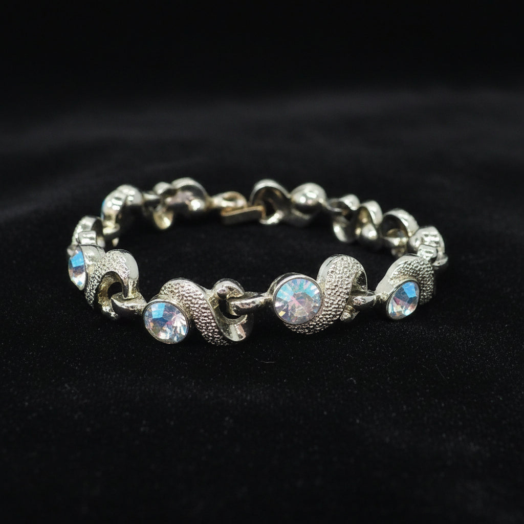 1950s Mid Century Vintage Aurora Borealis Crystal Bracelet on black velvet background.