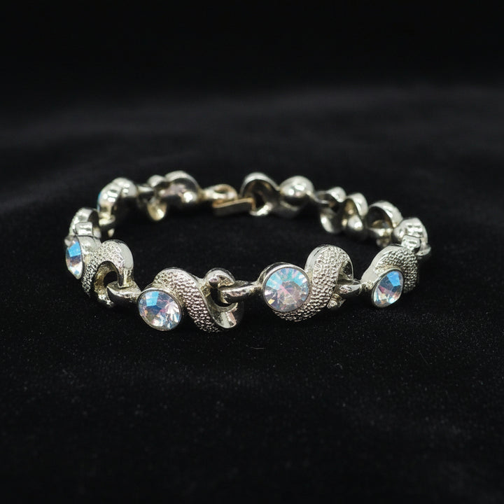 1950s Mid Century Vintage Aurora Borealis Crystal Bracelet on black velvet background.