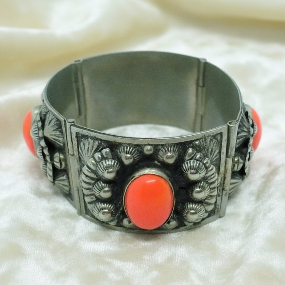 1960s Alpaca Silver Bracelet with Coral Lucite Cabochons on white ground.