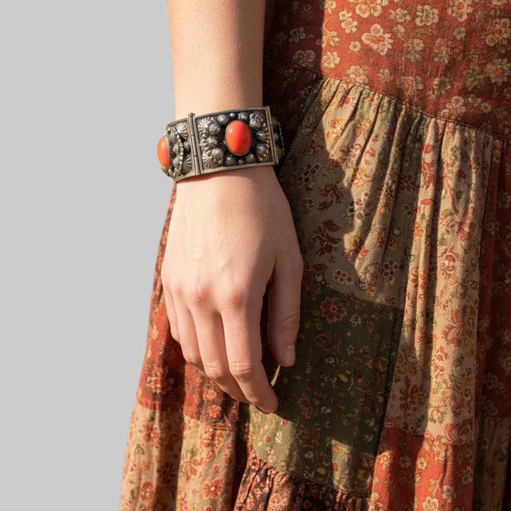1960s Alpaca Silver Bracelet with Coral Lucite Cabochons on woman wearing gypsy skirt.