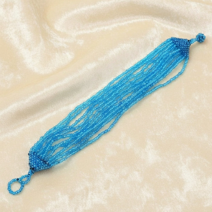 1960 Mermaid Blue Beaded Bracelet shown flat on white background.