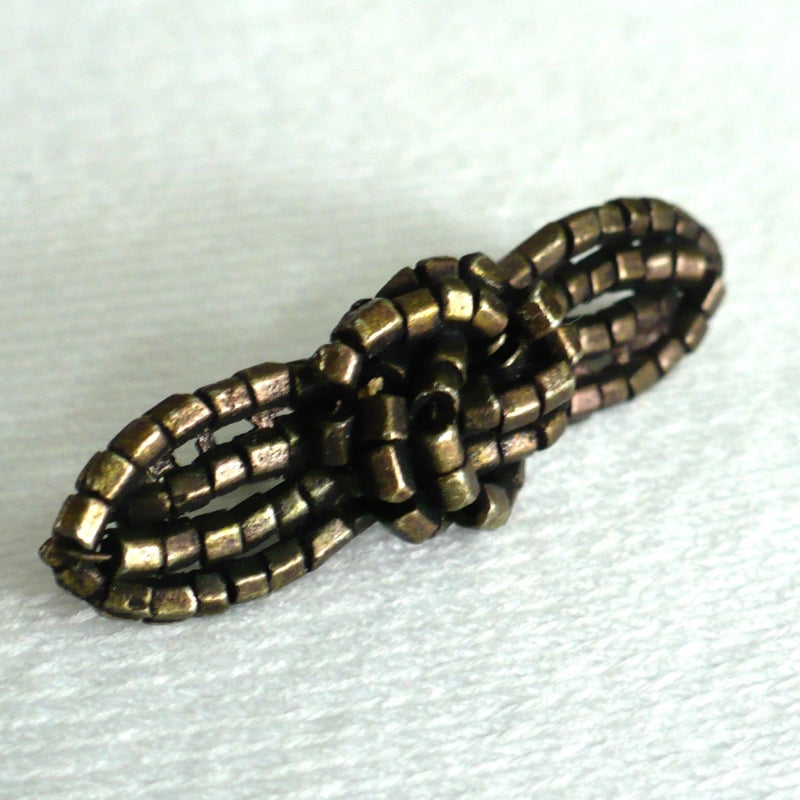 Edwardian Bronze Beadlook Millinery Sewing Brad Bar Ornament.