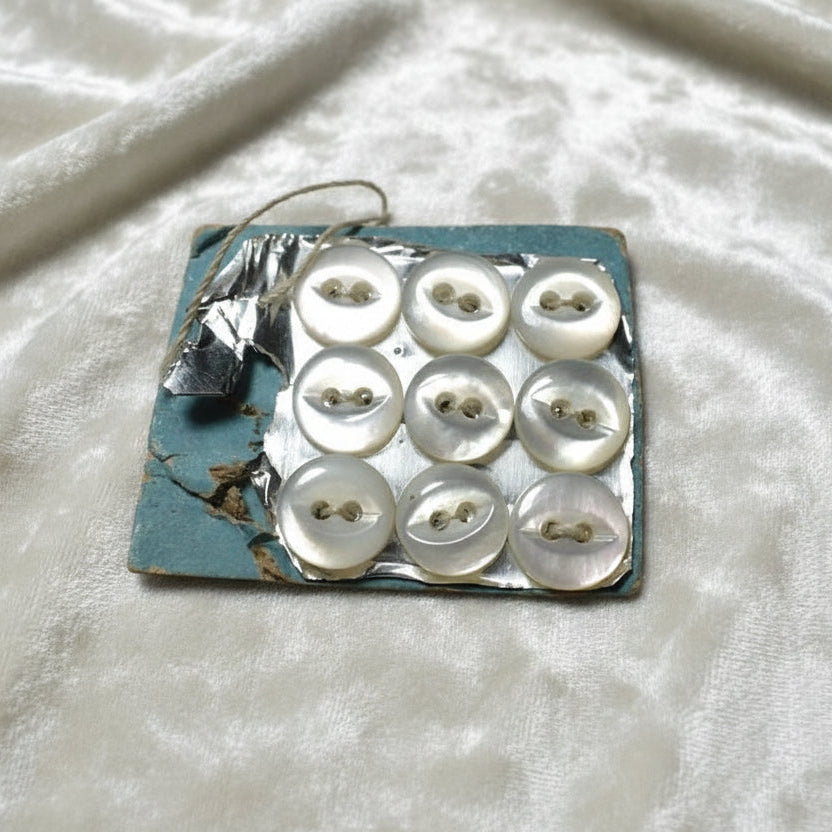 9L Set of Nine Two-Hole Fish Eye Pearl Diminutive Buttons, 1/4".