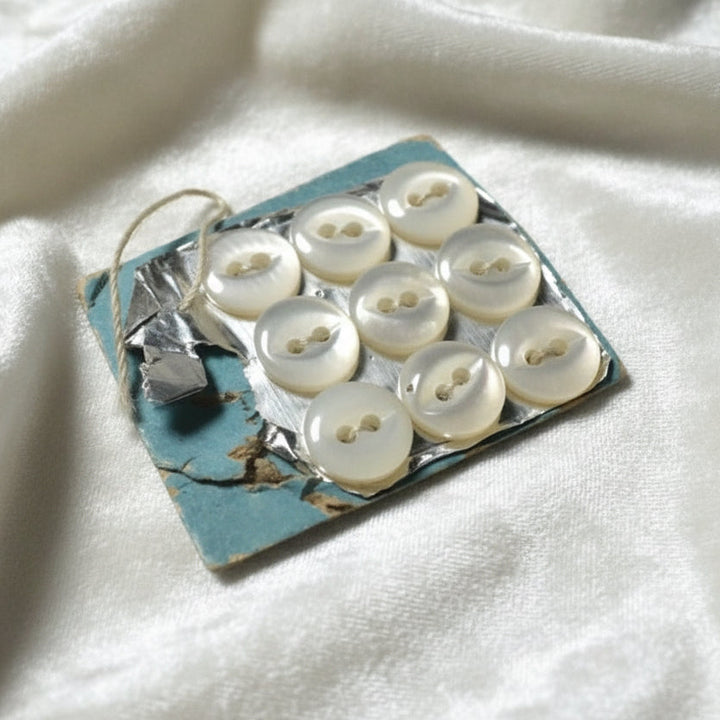 9L Set of Nine Two-Hole Fish Eye Pearl Diminutive Buttons, 1/4".