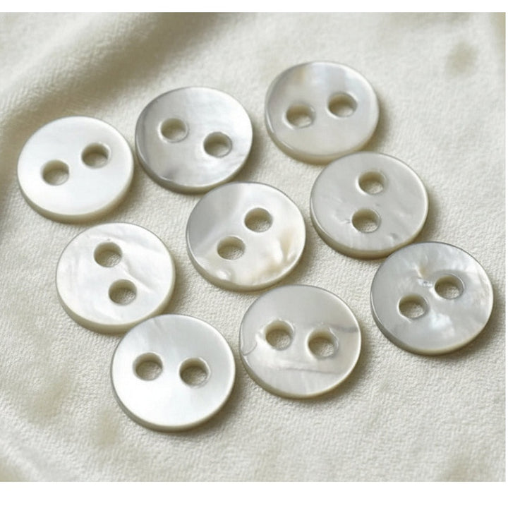 17L Set of Nine 1930s-50s Two-Hole Trochus Pearl Shirt Buttons, 1/2".