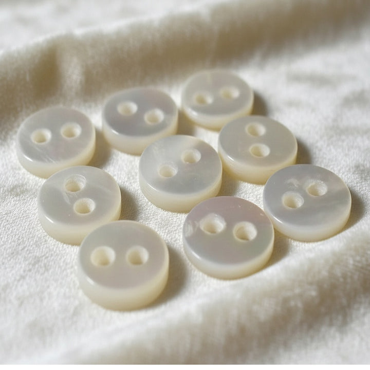 17L Set of Nine 1930s-50s Two-Hole Trochus Pearl Shirt Buttons, 1/2".