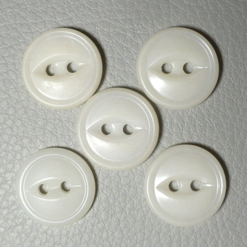 22L Set of Five White Celluloid Two Hole Fish Eye Buttons, view of tops on textured grey background.