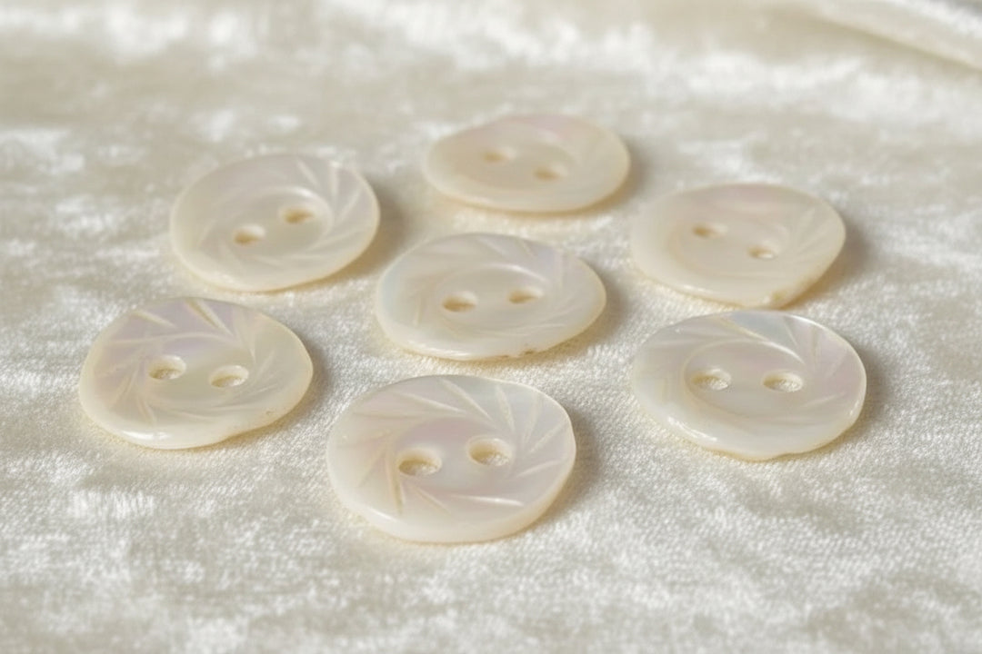 13L Set of Seven Two-Hole Fancy Conch Shell Dimi Buttons, 1/4".