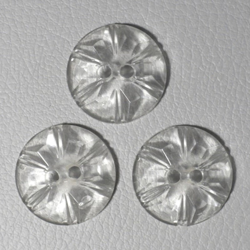 Tops or faces of 30L Set of Three 1950s Clear as Crystal Lucite Two-Hole Buttons, 3/4", on gray background.